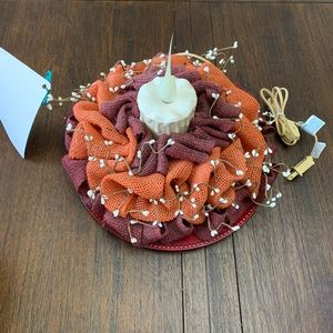 Centerpiece decor with light in the middle.